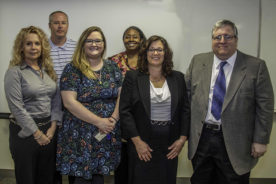 left to right: Marie McDevitt of Garnet Valley; Natalie Alsis, interviewer from Dunwoody Village; Deborah McArdle of Parkesburg; and Greg Sandborn of Paoli. Back row, from left to right: Doug Ferguson, interviewer and Director of Alumni Relations at Delaware County Community College, and interviewer Terri Cooper-Smith, of the Pennsylvania Public Utility Commission